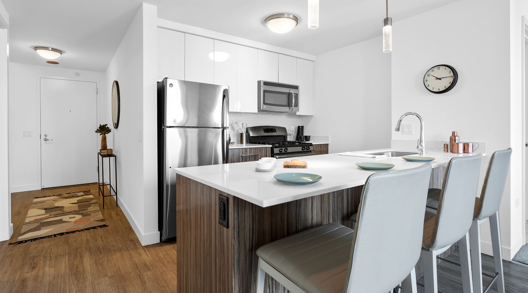 River North \\ River Views dining counter in kitchen with pendant lights